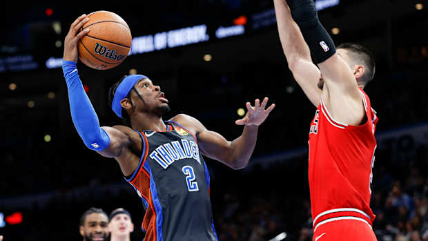 Oklahoma City Thunder guard Shai Gilgeous-Alexander defended by Chicago Bulls center Nikola Vucevic